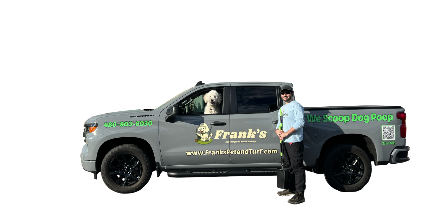 Person standing next to a gray truck with 'Frank's Pet & Turf' branding in front of a house.